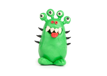 Green Monster of plasticine isolated on whiteの写真素材