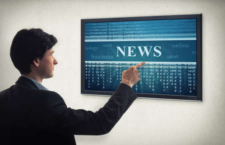 businessman presses interface. online newsの写真素材
