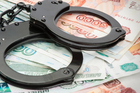 Handcuffs on Russian moneyの写真素材