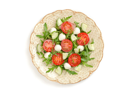 salad with tomatoes and mozzarella isolatedの写真素材