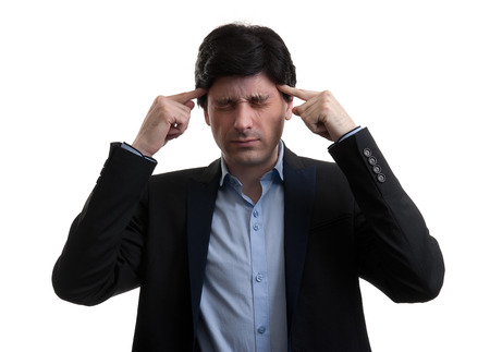 Frustrated business man with a headache. Isolated over whiteの写真素材