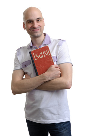 English education. Happy casual man with book. Isolated on white の写真素材