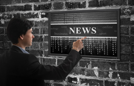 online news concept. Business man reading information on screenの写真素材