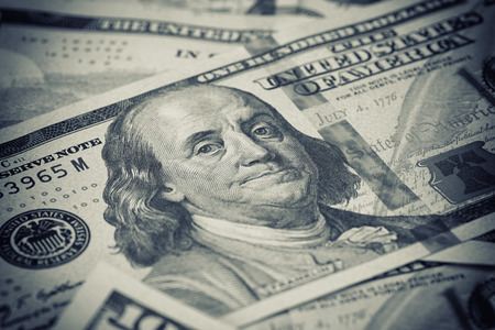 Stack of US Dollars backround. Notes face value of 100 US dollars