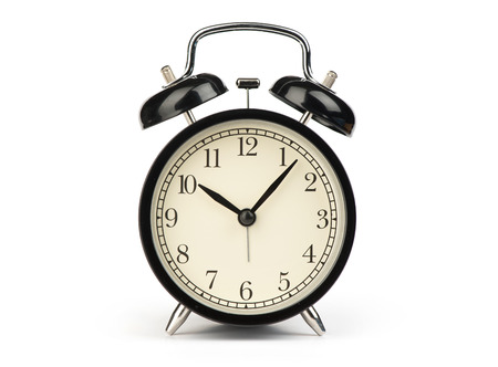 Black alarm clock isolated on a white