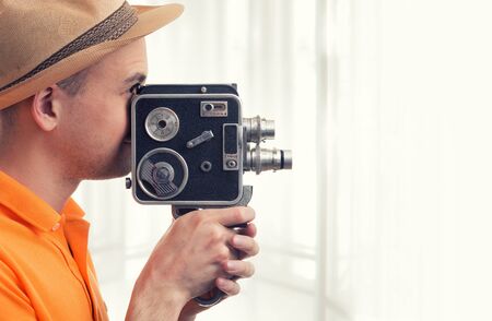 cameraman make film on a retro cameraの写真素材