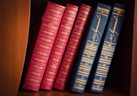 close up of vintage old books on wooden tableの写真素材