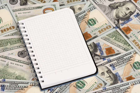 Notepad and heap of dollars With Copy Spaceの写真素材