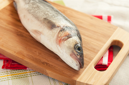 close up of Fresh raw fish on cutting boardの写真素材