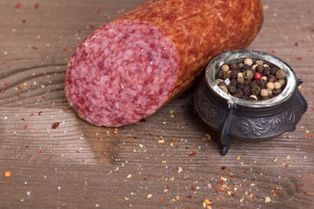 close up of Salami sausage on wooden backgroundの写真素材