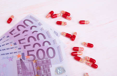 close up of red pills and money. Healthcare conceptの写真素材