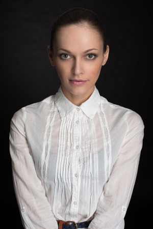 Beautiful Brunette Girl. caucasian woman low key portait over dark backgroundの写真素材