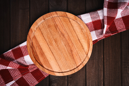 kitchen table top view. Cutting board on wood backgroundの写真素材
