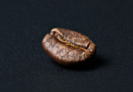 macro of coffee bean on a black background