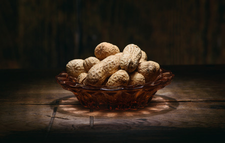 heap of peanuts on rustic wooden table. Close upの写真素材