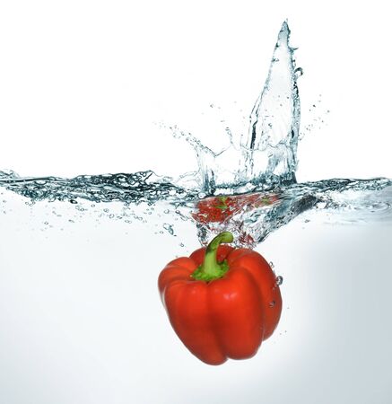 close up of fresh bell pepper in waterの写真素材