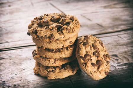 Chocolate chip cookies on rustic wooden backgroundの写真素材