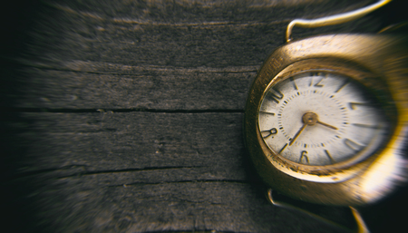 retro watch on wood tableの写真素材