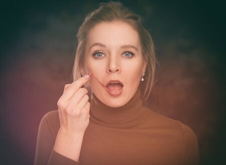 portrait of beautiful girl with lipstick. Makeup conceptの写真素材