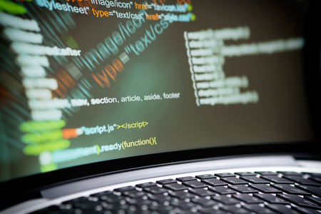 HTML code on a laptop screen. Editor for website concept.の写真素材