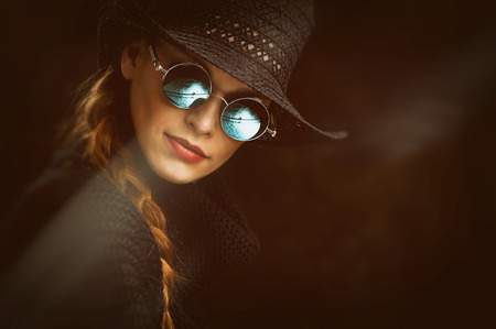Portrait of Young beauty woman in steampunk round glasses.の写真素材