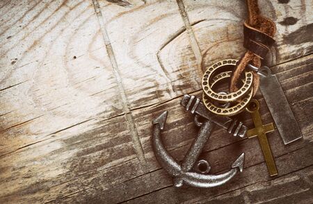 anchor on a grunge wooden desk with copy spaceの写真素材