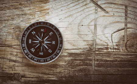 top view of compass on wooden backgroundの写真素材