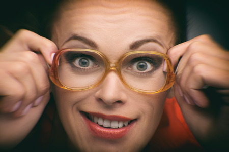 Close up Portrait of a funny girl with glassesの写真素材