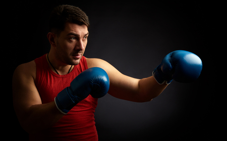 man boxing on black background. Isolated with copy spaceの写真素材