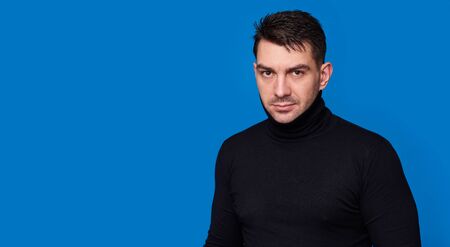 handsome bearded man isolated on blue background