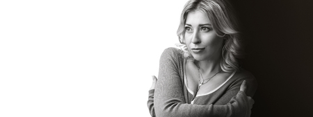 black and white portrait of cute woman looking away. Copy spaceの写真素材