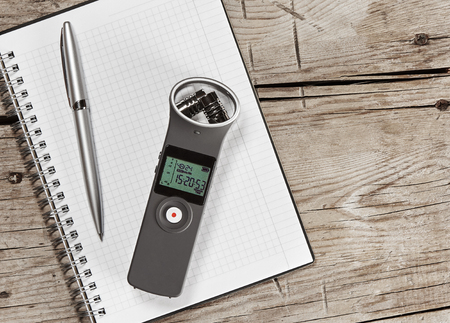 audio recorder with external microphone and notepad. Make notes. Blogging conceptの写真素材