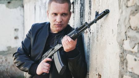 contracted type killer agent with automatic rifle