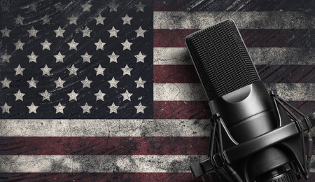 Microphone. Modern sound system equipment for a vocal performer. Mic isolated on black background.の写真素材