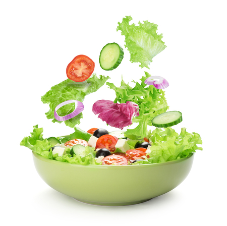 Salad with cheese and fresh vegetables isolated on white background. Greek salad.の写真素材