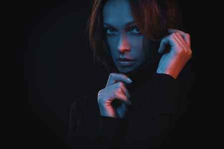 close up portrait of beautiful woman face with colorful filtersの写真素材