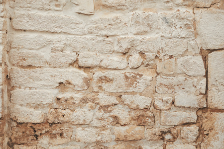 ancient white brick wall texture. Old cracked stone backgroundの写真素材