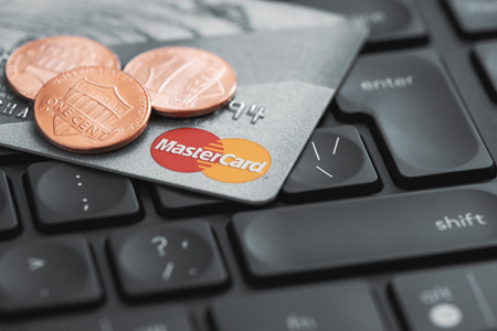 Moscow, Russia - September 20, 2018: Mastercard credit plastic card on computer keyboard