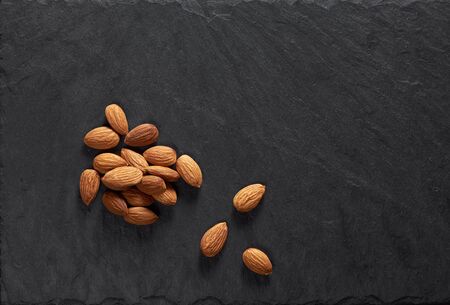 almond nuts on a stone table. Top viewの写真素材