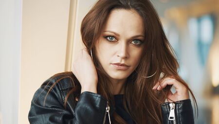 Beautiful woman face. Outdoors portrait of a brunette girlの写真素材