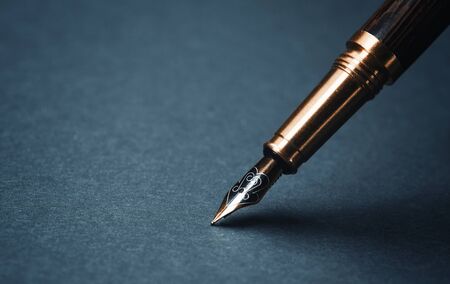 Old fountain pen on a black backgroundの写真素材