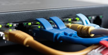 cables connected to network switch, close up