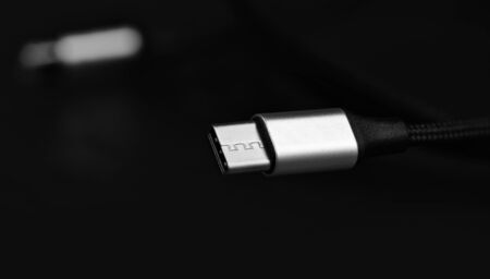 USB Type-c cable on black background. Macro shot
