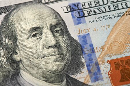 Portrait of US president Benjamin Franklin on 100 dollars banknote.