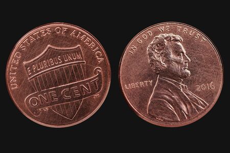 Old scratched american cent coin. Us currency isolated on black backgroundの写真素材