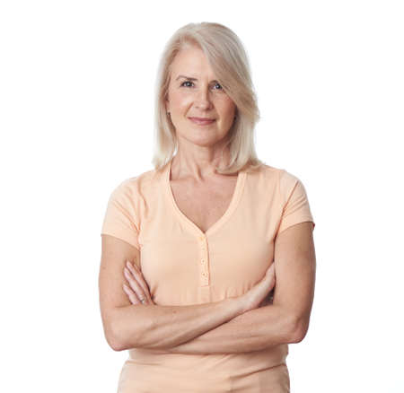 Smiling middle aged mature gray haired woman looking at camera. Positive senior retired female...