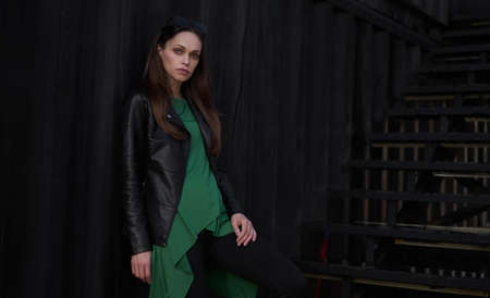 Pretty brunette woman in the city. Outdoors portrait