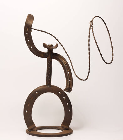 metal art cowboy made with horse shoesの写真素材