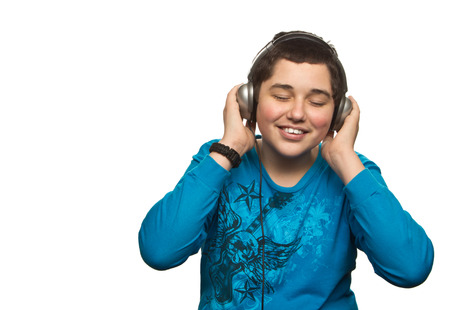 Boy with headphones isolated on white の写真素材