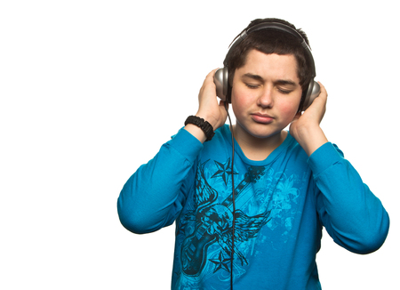 Boy with headphones isolated on white の写真素材